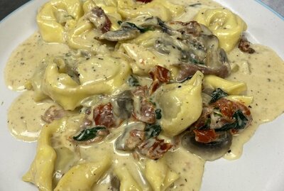 TORTELLINI AL PROSCCIUTTO  ( Allergens: Lactose, Gluten Wheat, Egg.)