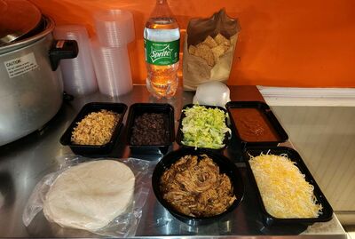 FAMILY MEAL DEAL meat, rice, black beans, Chips, tortillas, salsa, cheese and lettuce