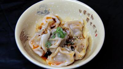 Steamed Pork & Veggie Dumplings in Special Sauce 钟水饺