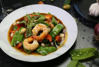 SNOW PEAS MACADAMIA PRAWNS